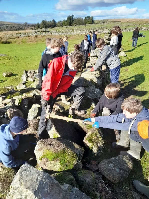 Young adults building a wall